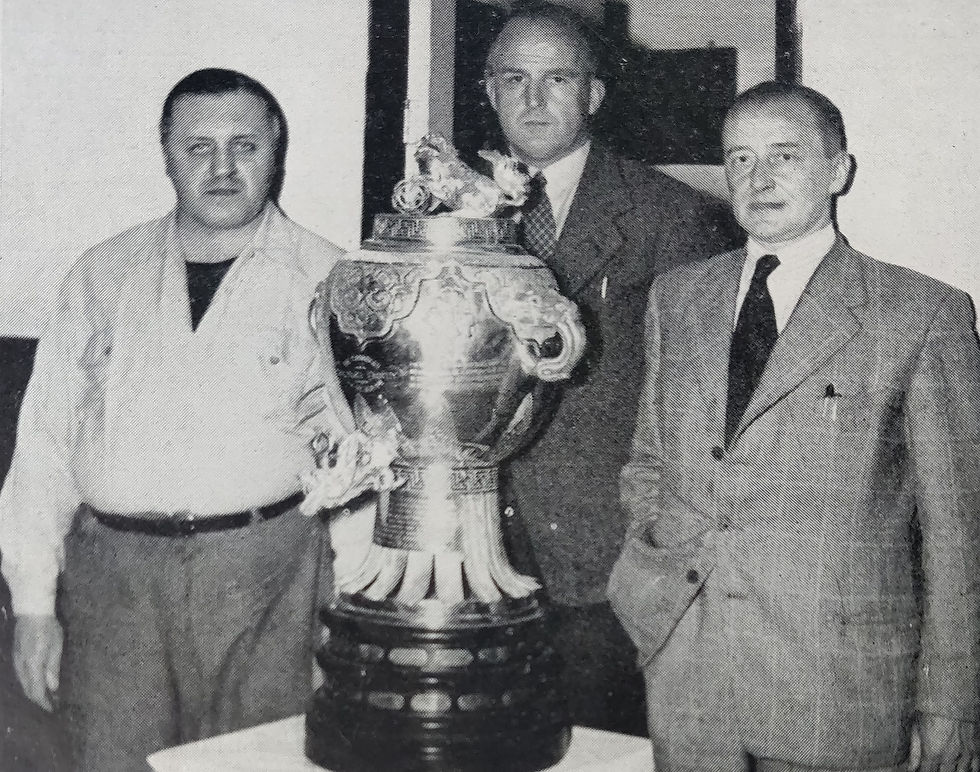 October 1950 - Cyril Beastall (centre) with 'Jerry' Chambers (left) as he donates the Chambers Trophy to the National Skating Association