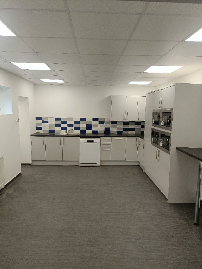 large kitchen space with fitted units