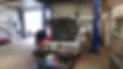 J A G Auto Engineers mechanic working on silver car