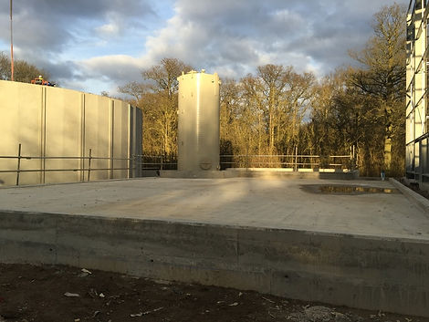 biogas cylinder next to concrete slabs