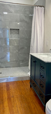 Private bath with a tiled walk-in shower