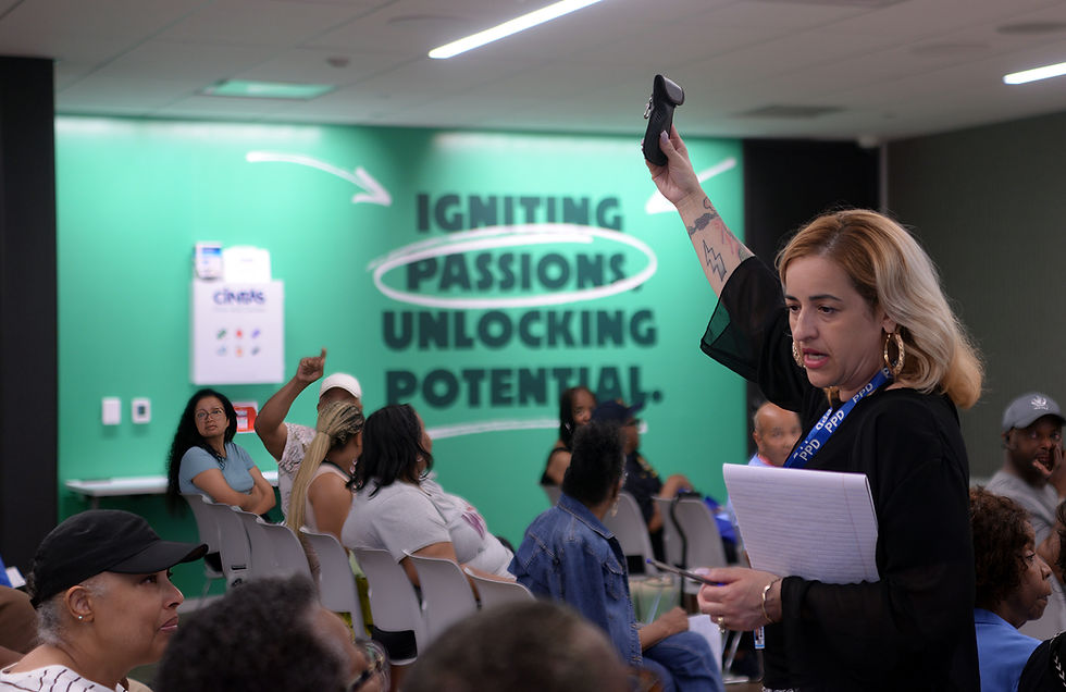 Maribelen Carrasquillo, Community Initiative Specialist, holding up a "Faraday Bag."