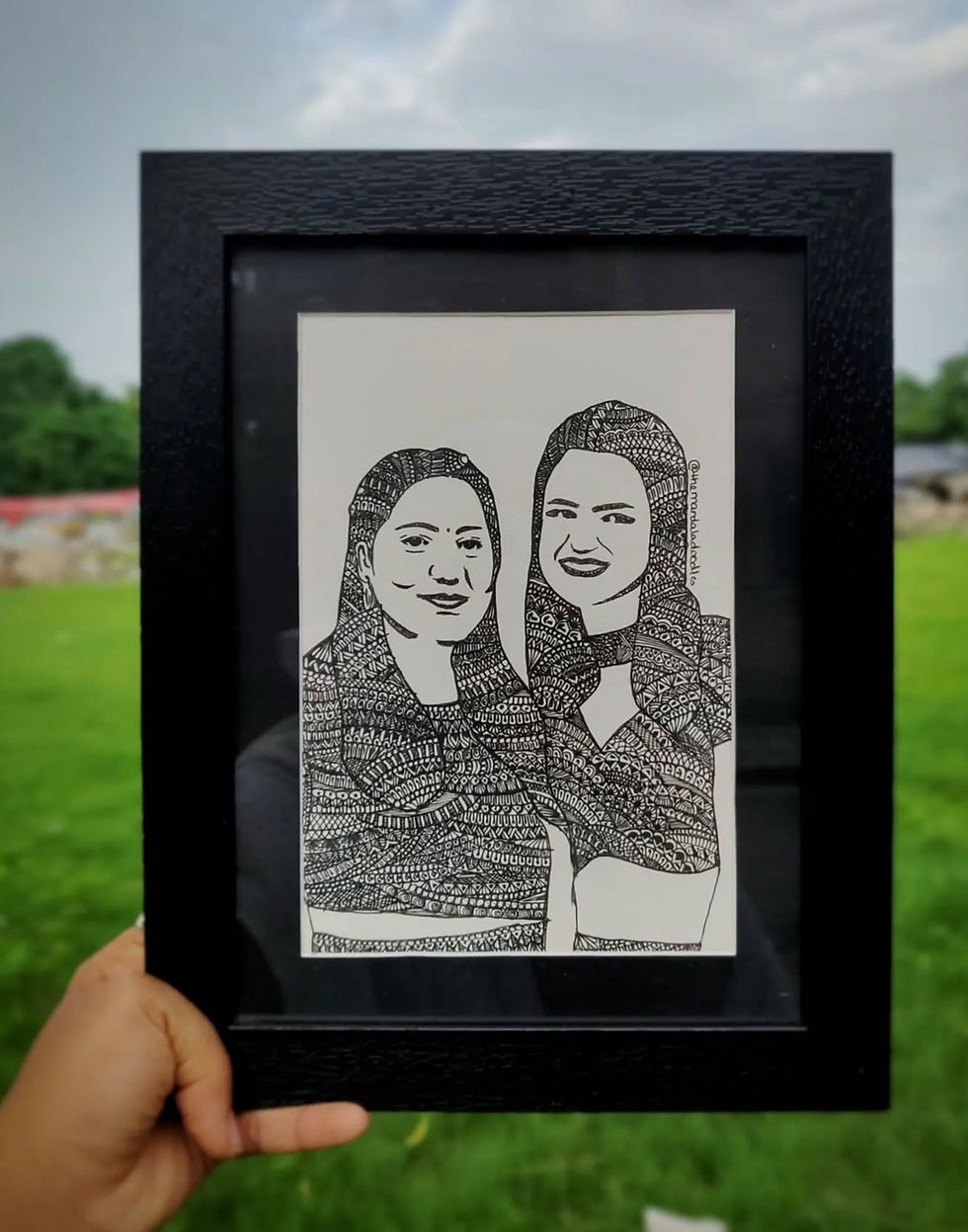 Personalized portrait surrounded by hand-drawn Mandala designs