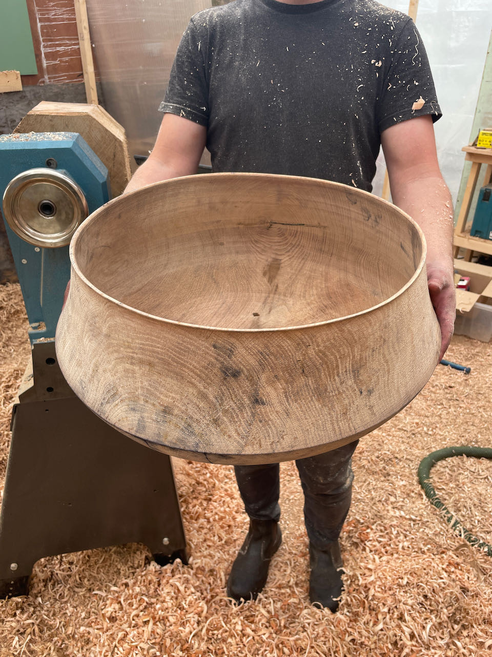 Barnaby holding the vessel fresh off the lathe for size comparison