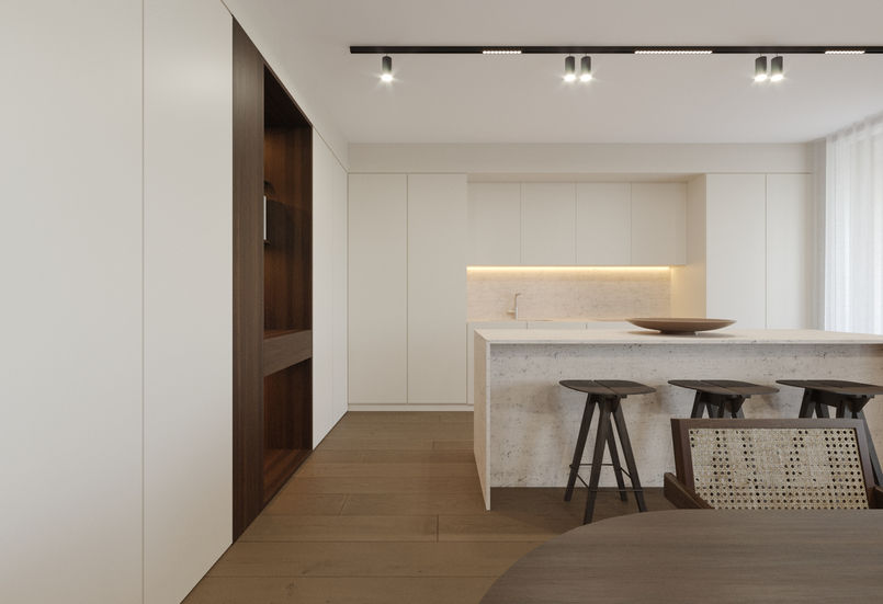 Appartamento dallo stile minimale e raffinato.

Spazi ampi, delimitati da volumi pieni,  caratterizzati da nicchie in legno e pietra che arricchiscono l’ambiente.

Colori caldi dominano la scena, tra legno scuro, tessuti beige e pannelli color crema, rendendo l’appartamento accogliente ed elegante.