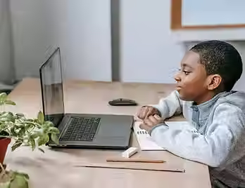 ADHD child focusing on screen time and video games