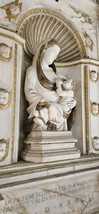marble sculpture called madonna of the milk, with golden details
