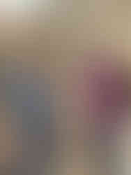 A man receiving a gift certificate from the Sandals Foundation.