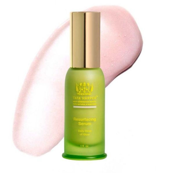 bottle of Tata Harper Resurfacing Serum and its pink serum smeared behind