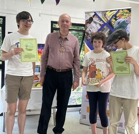 Eric, Eleanor and Jacob from EDGE disability with the Mayor of Woking Rob Leach