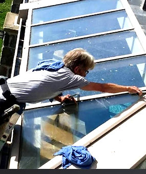 Man washing exterior windows