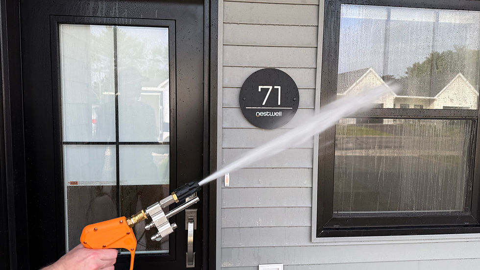 Eye-level view of a soft wash pressure washing service in action
