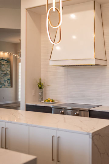 Transitional kitchen with custom cabinetry and warm finishes