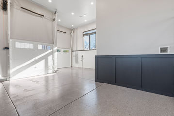 Bright modern garage with custom cabinetry and clean lines in Wichita KS