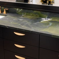 Custom bathroom vanity with dark cabinetry and stone countertop Wichita Kansas