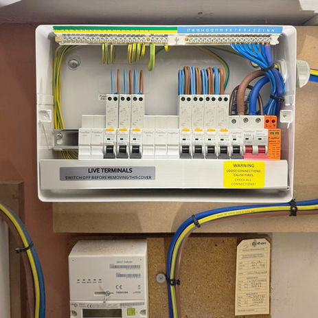 **Alt text:**
Modern UK consumer unit (fuse board) installed by CSL Newmarket Electrical, featuring RCBO protection and clearly labelled circuits for enhanced electrical safety.