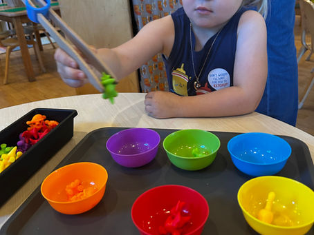 preschool aged child playing with a sorting game at the Fox Hill School in Danvers, MA