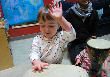 Child playing with drum