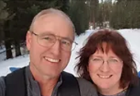 Cathy and Sam smiling at the camera