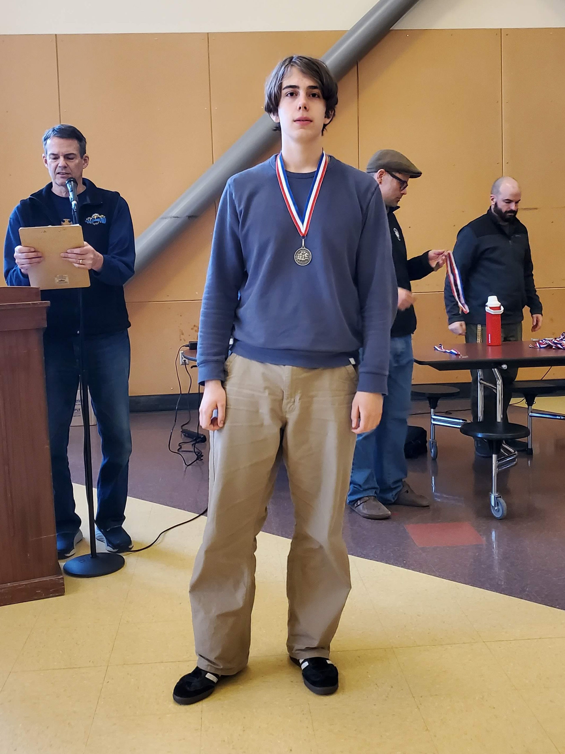 A student wearing a medal.