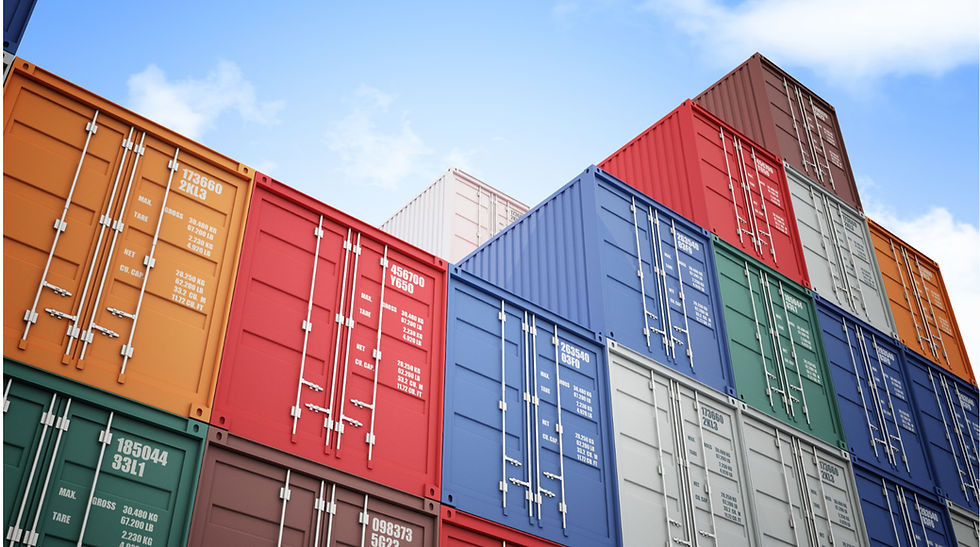 Stacks of multi-colored shipping containers neatly arranged in a large outdoor container yard.
