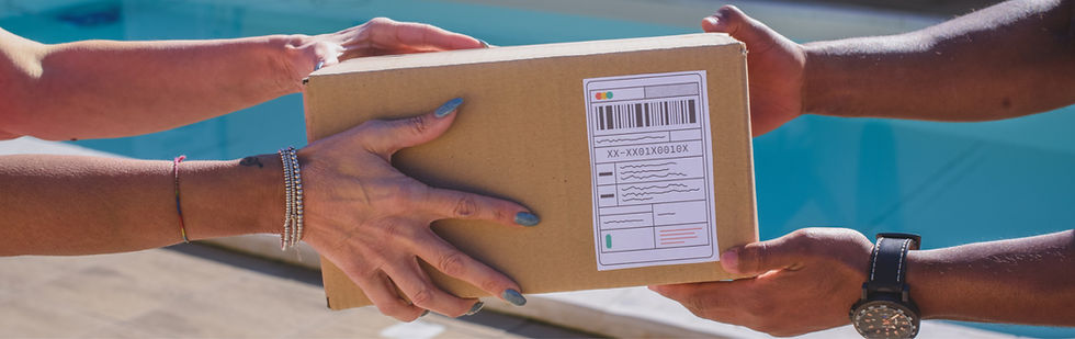 A courier package being passed from one set of hands to another, representing the handoff during the delivery process.