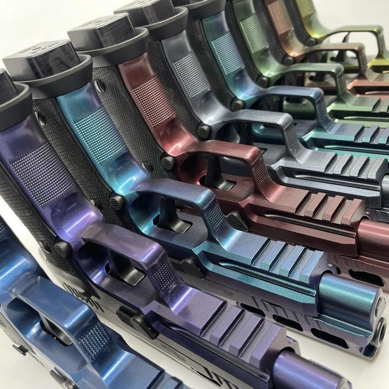 Row of handguns with Clear Cerakote finishes - MC - Series
