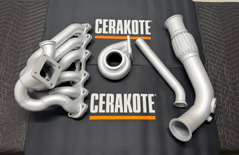 Silver Cerakote engine parts including a turbo and manifold. C - Series