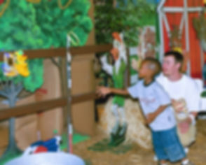 Child playing the Ring Toss Carnival Game at a Company Picnic in Nashville, TN