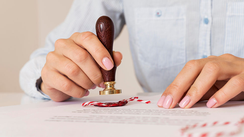 person-using-wax-seal-blurred-certificate.jpg