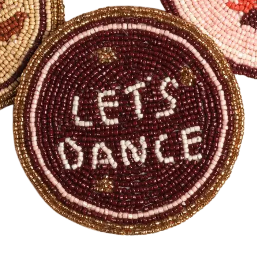 Thumbnail: Hand-beaded ‘Let’s Dance’ coaster in burgundy, blush, and gold with round bead pattern and small gold accents.