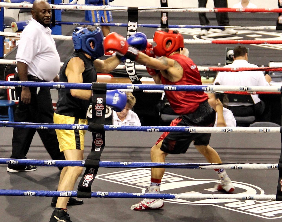 Boxer throwing a jab during a Masters boxing bout.