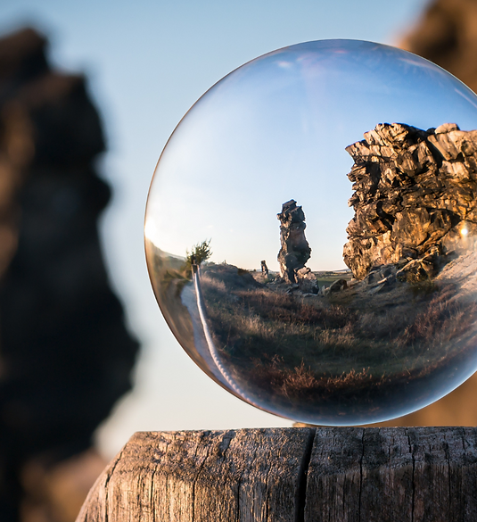 Glass ball sitting on a beach