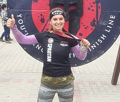 Zuza showing her winner medals