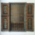 A window inside the Bahia Palace, showing intricate woodwork and painting.