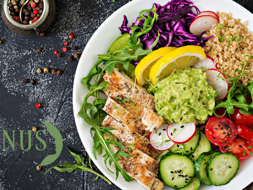 Plate of colourful, healthy balanced food including chicken, salad and brown rice.