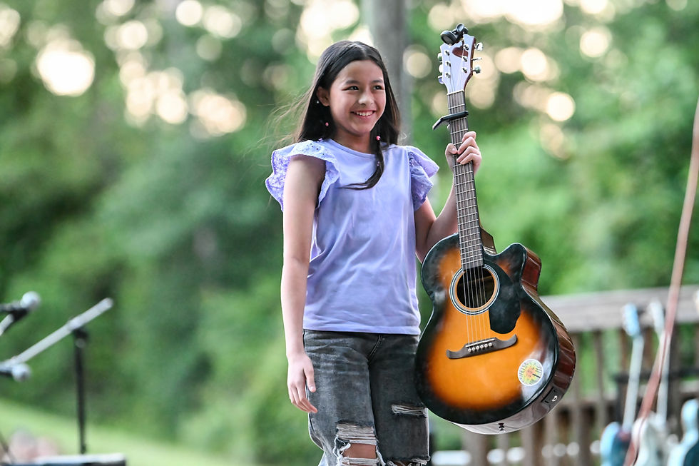 Guitar student on stage