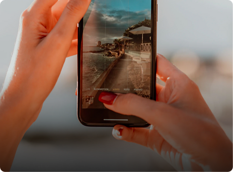 Woman holding phone.png