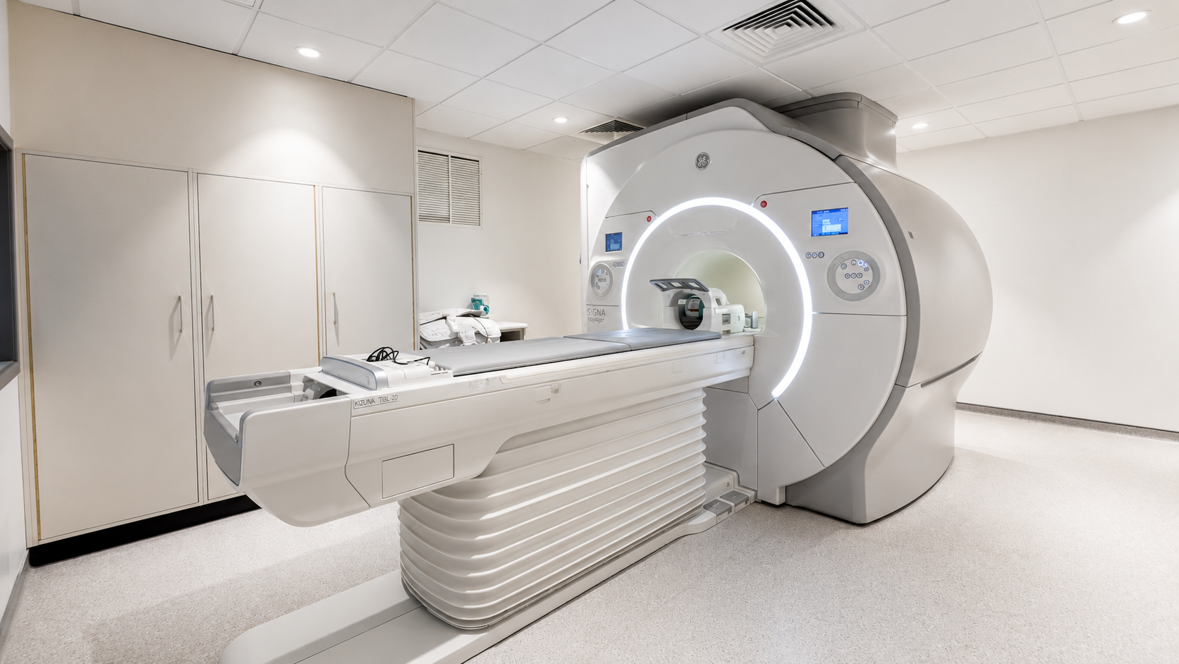 A GE SIGNA MRI scanner installed in a clinical scan room