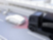 A driver's identification card placed next to a modern key fob used for vehicle access and ignition. The ID card shows the driver's details, while the key fob features buttons for remote control functions.
