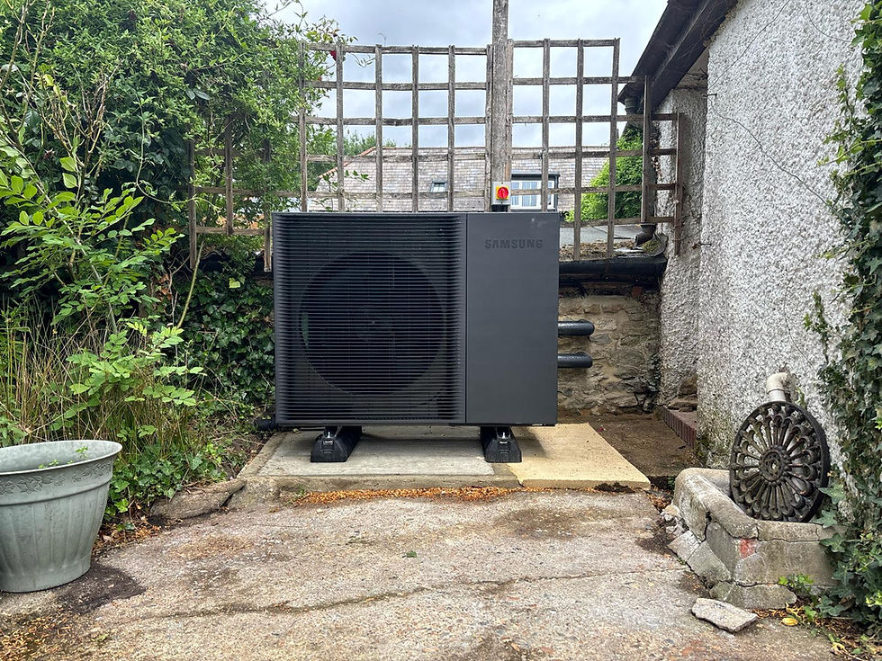 Samsung R290 heat pump installed next to an outbuilding in the garden