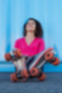 young-woman-with-rollerskates-2021-08-26-15-34-40-utc.jpg