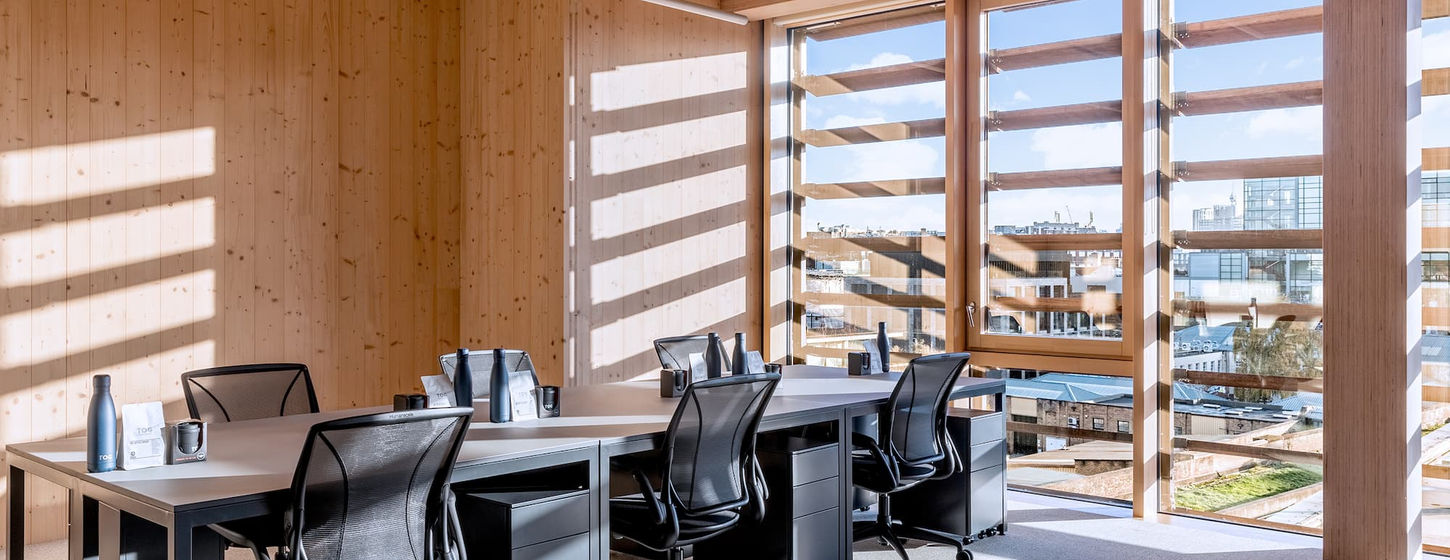 Black and White Building featuring thermally modified tulip wood and mass timber