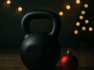 A kettle bell sits next to a Christmas tree ornament for holiday fitness.