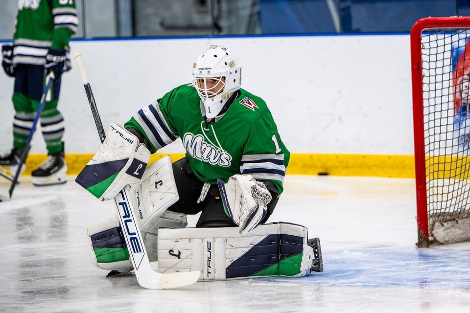 Mavericks goalie, Rob Cook makes a save.