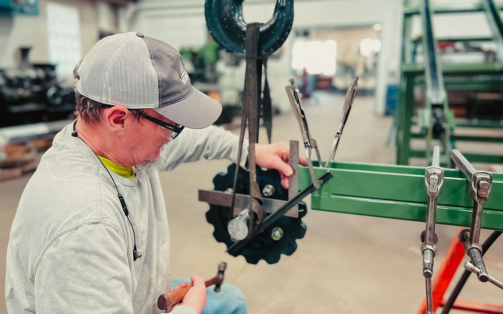 An HMC team member performs equipment maintenance