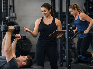 A trainer works with a client at GRIT Strength & Functional Training