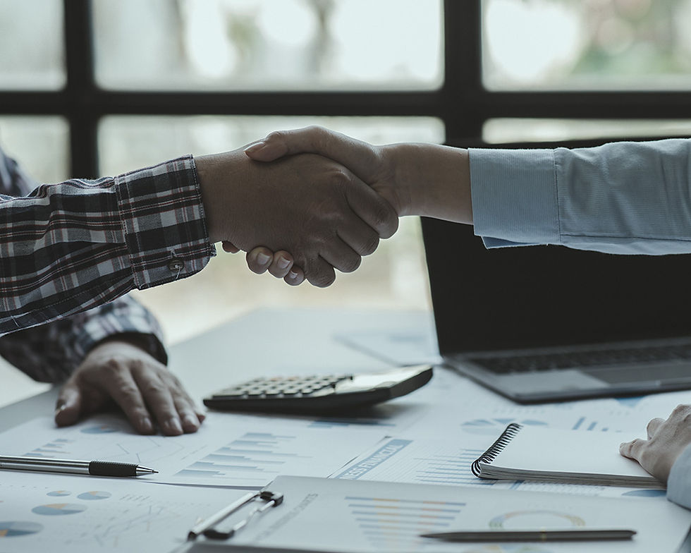 An HMC customer shakes hands to secure equipment financing.