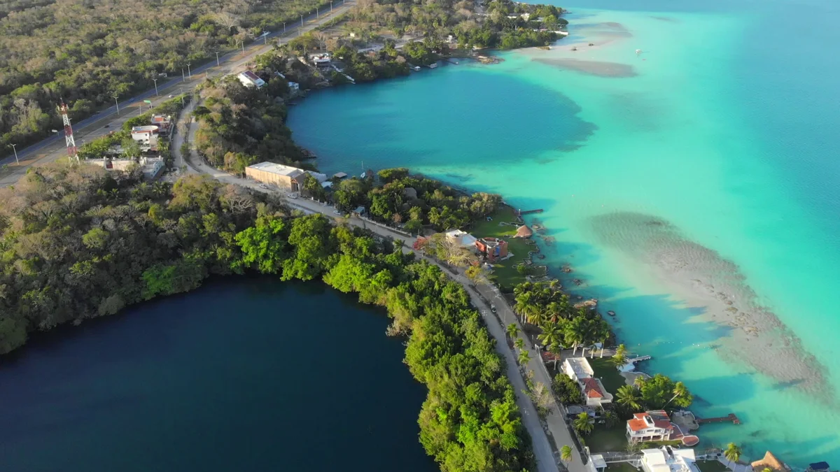Aerial view of Cenote Azul and the turquoise waters of Bacalar Lagoon in Mexico