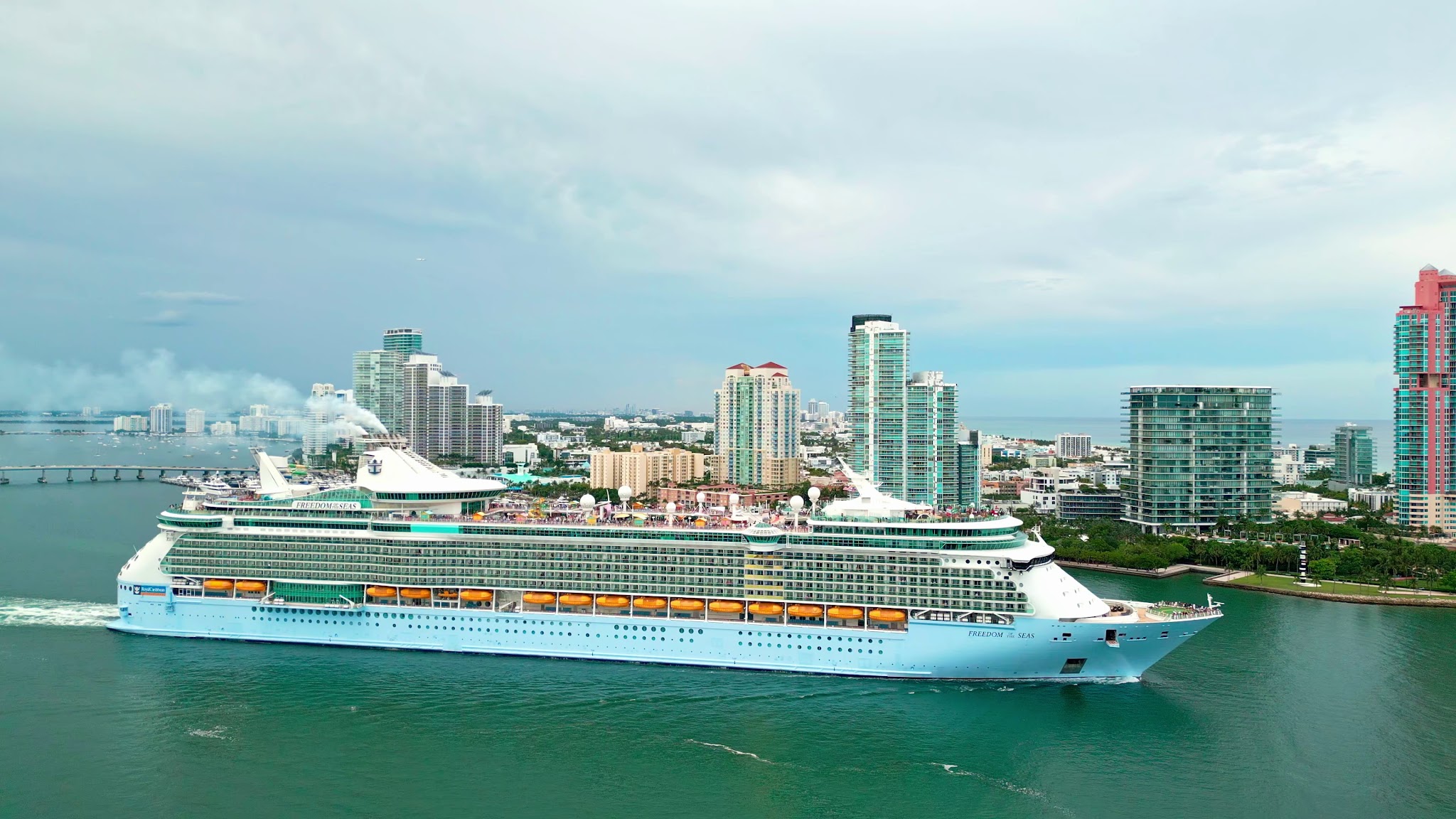 Freedom of the Seas sailing beside Miami Beach